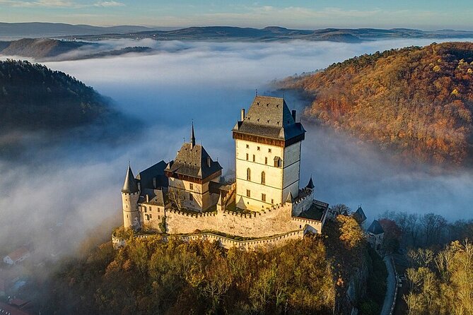 From Prague: Small-Group Karlstejn Castle & Koneprusy Caves Trip - Karlštejn village gives the castle a human scale