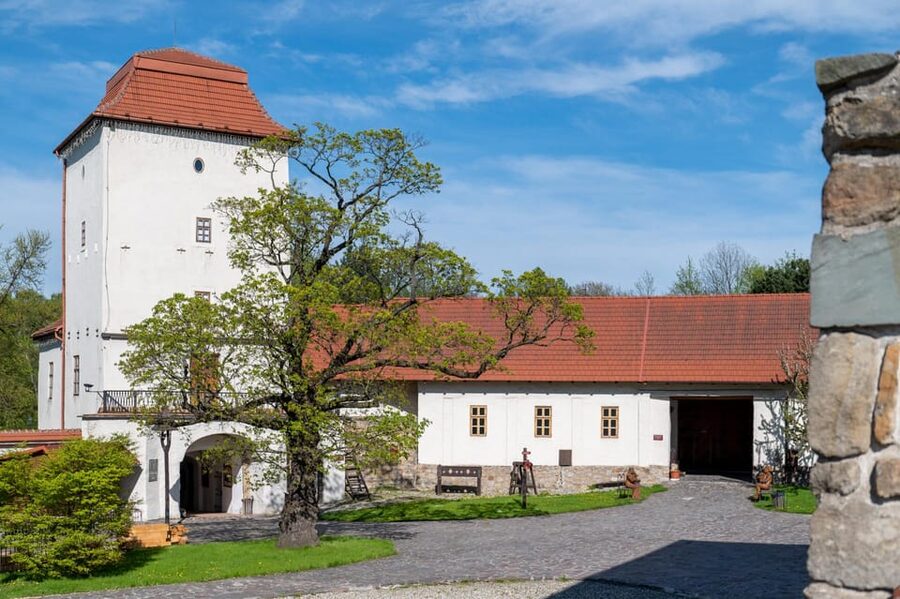 Ostrava: Entrance to Silesian Ostrava Castle - Green grounds, deck chairs, and the amphitheater
