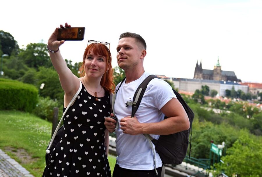 Panoramic Views of Prague Evening Walking Tour - Crossing Charles Bridge under the lights