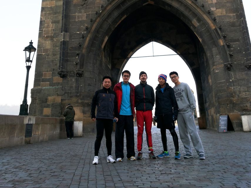 Prague 1.5-Hour Compact City Center Running Tour - Crossing Charles Bridge at running pace