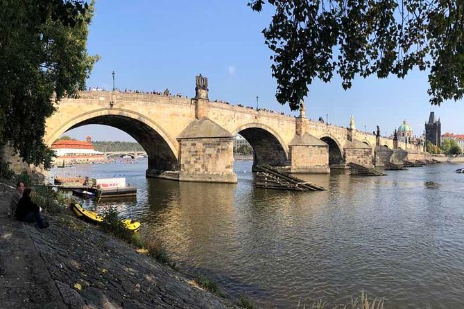 Prague: Classic City Bike Tour (small groups) - Lennon Wall and Charles Bridge from the riverbank