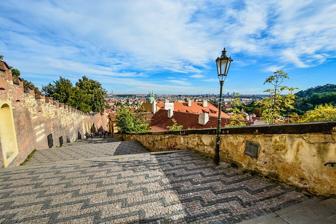 Prague DeLuxe Tour: Views, Hidden Gems, Tastings & River Cruise - Crossing Charles Bridge into Lesser Town