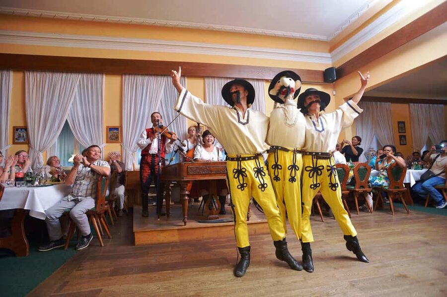 Prague: Folk Dancing Dinner Experience - Entering the Decorated Restaurant