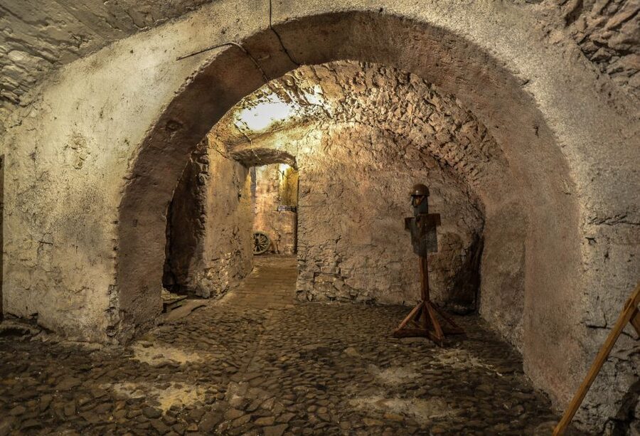 Prague: Ghosts, Legends, Medieval Underground & Dungeon Tour - The first secret stop, twenty minutes below the streets