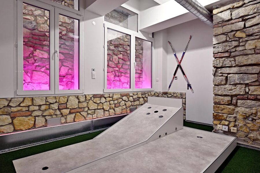 Prague: Mazemania Miniature Golf Experience - The bar, games, and time between rounds