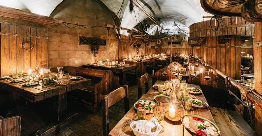 Prague: Medieval Dinner with Unlimited Drinks - Entering U Pavouka Medieval Tavern
