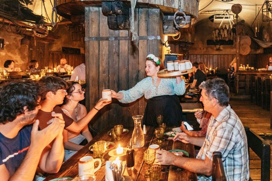 Prague: Medieval Dinner with Unlimited Drinks - Candlelight looks good, but eating can be tricky