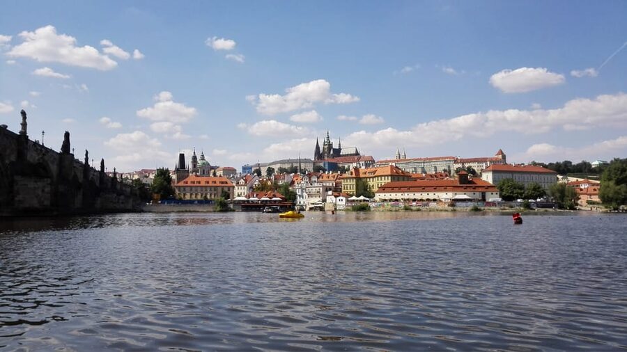 Prague: Old Town Guided Walking Tour and City Boat Ride - Reaching Charles Bridge and changing pace