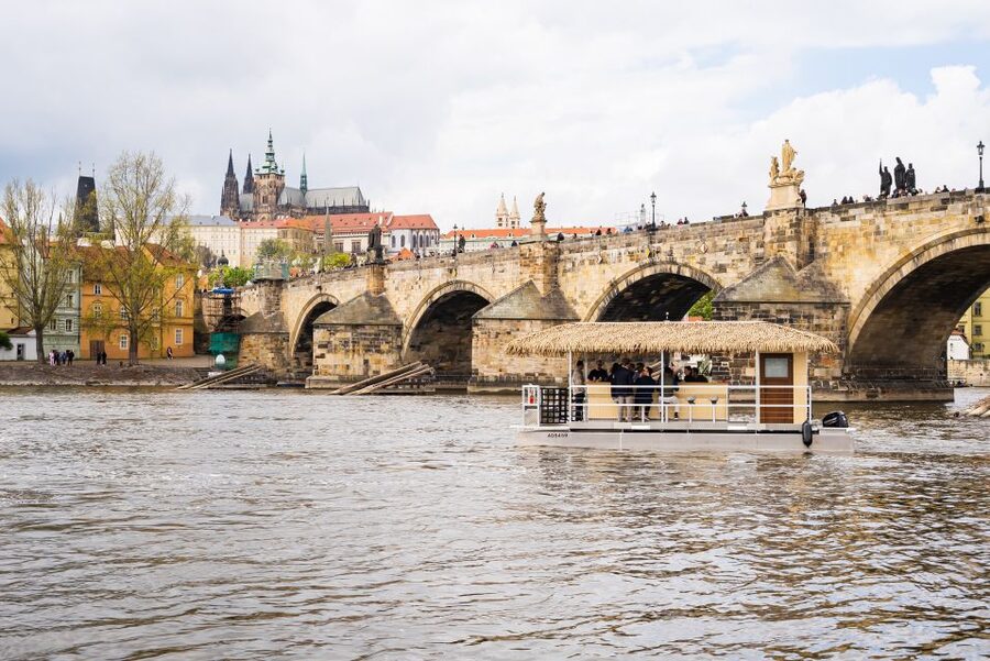 Prague: Party Tiki Boat Sightseeing Cruise with Drinks - Seeing Charles Bridge from the water