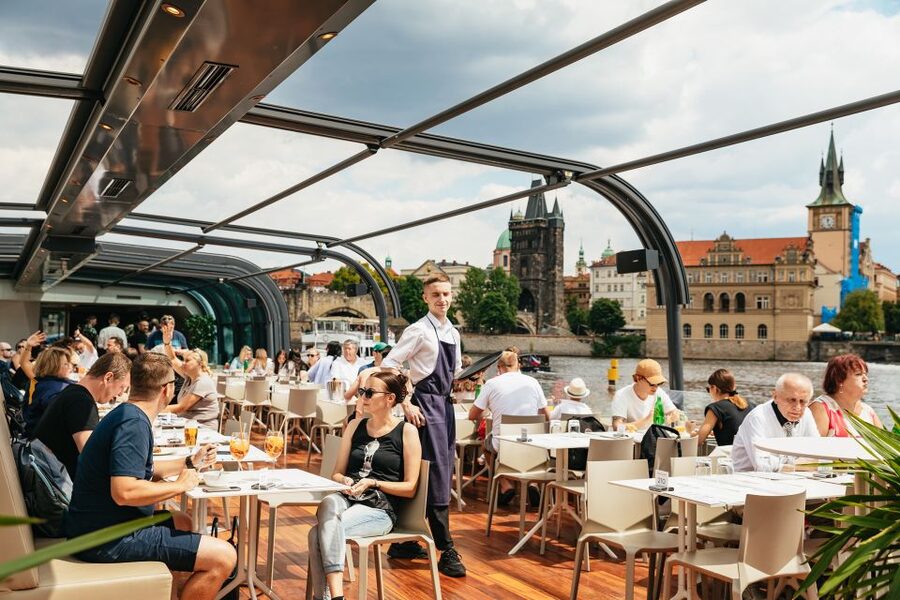 Prague: Vltava River Lunch Cruise in an Open-Top Glass Boat - The welcome aperitif and first views