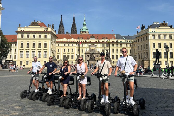 Scooter tours to Prague Castle and views. - Optional stops: the narrow street and Lennon Wall
