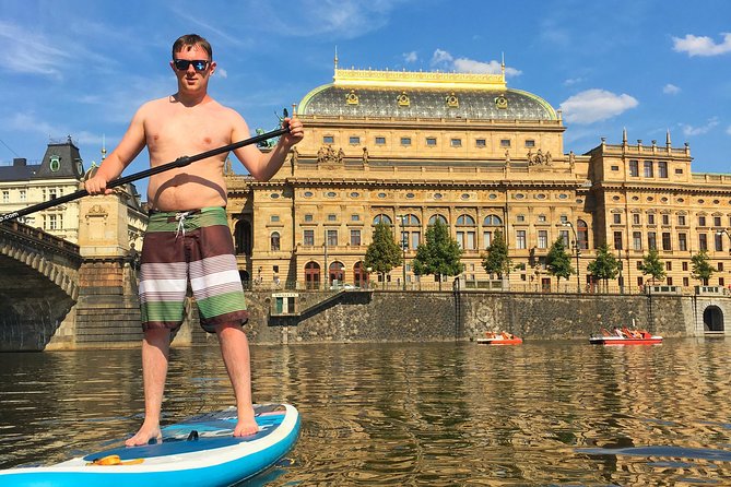 Stand-Up Paddleboarding on the Vltava River in Prague - Getting upright on the board with Sam or Samuel